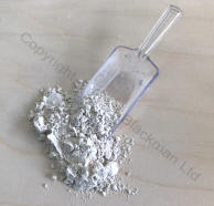 scoop of limestone dust